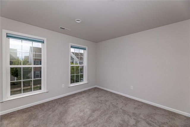 spare room with light colored carpet