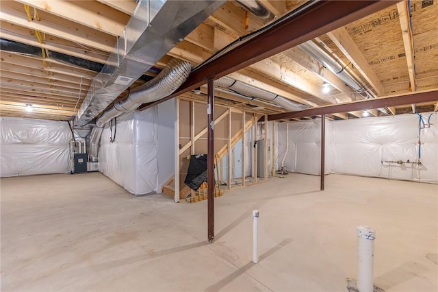 basement with water heater and heating unit