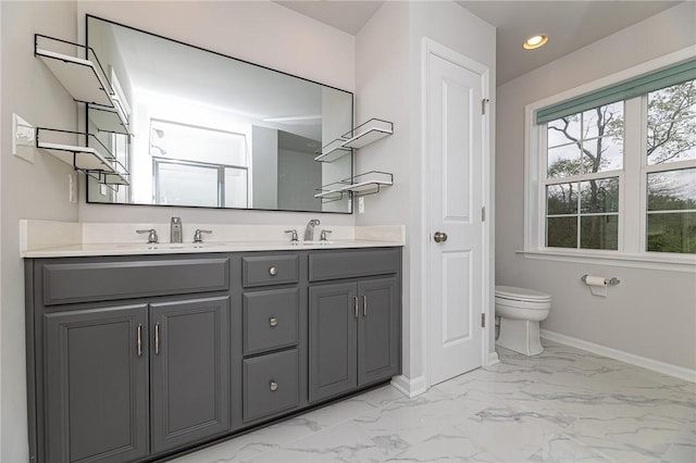 bathroom featuring vanity and toilet