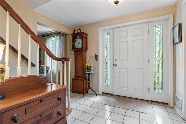 entrance foyer featuring light tile patterned floors