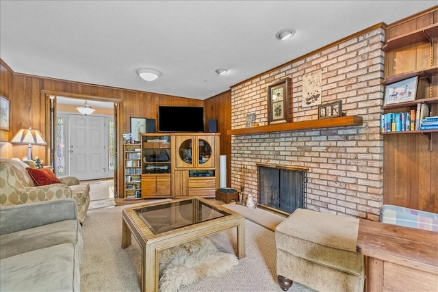 carpeted living room featuring a fireplace and wood walls