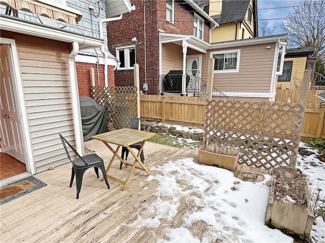 view of snow covered deck