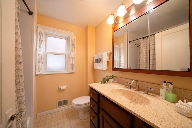 bathroom with vanity, walk in shower, and toilet