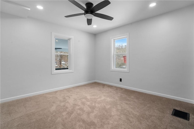 carpeted empty room with ceiling fan