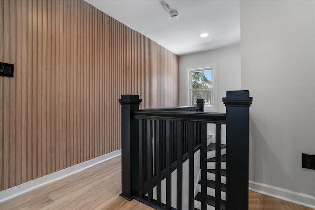 stairs featuring hardwood / wood-style flooring