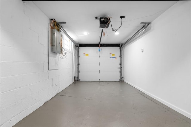 garage featuring a garage door opener and electric panel