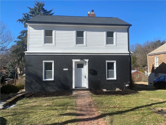 view of front property with a front lawn