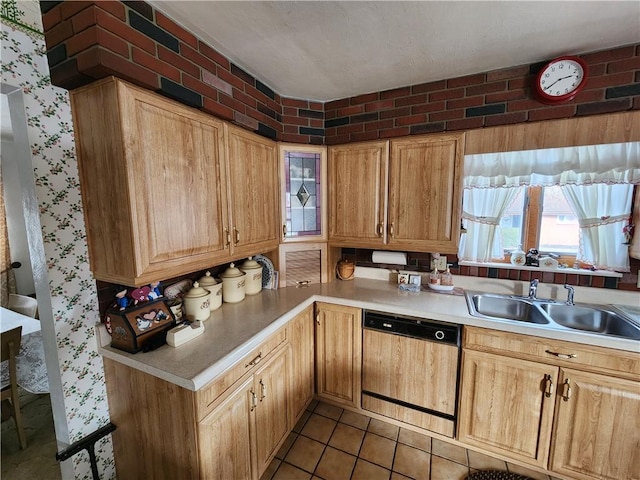 kitchen with sink, light tile patterned floors, and dishwasher