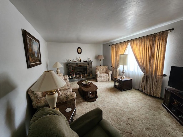 living room featuring a brick fireplace and carpet flooring