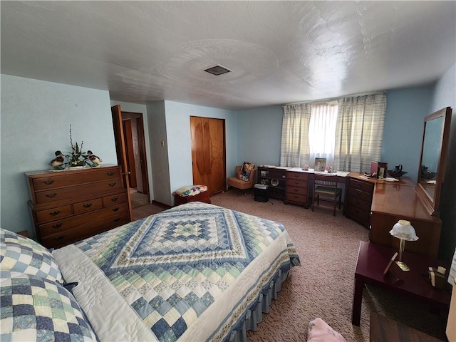 carpeted bedroom with a closet