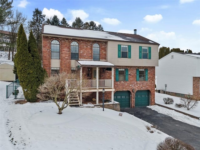 view of front of house with a garage and a porch