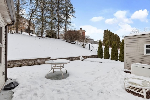 view of yard layered in snow