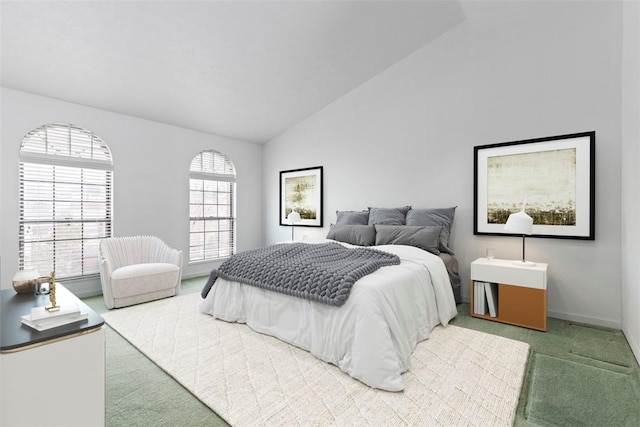 carpeted bedroom featuring vaulted ceiling