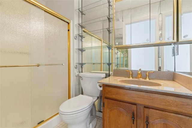 bathroom with vanity, toilet, and walk in shower