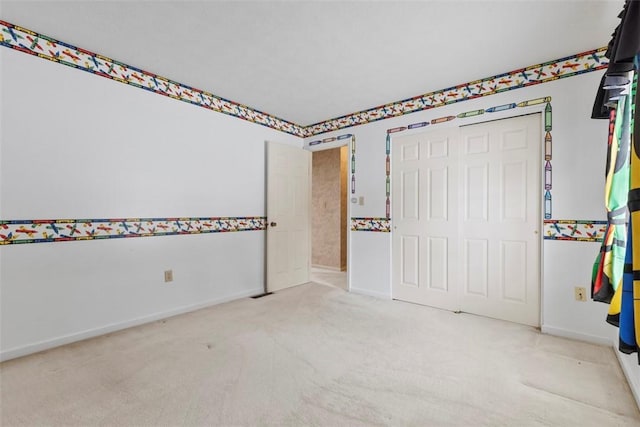 unfurnished bedroom with light colored carpet