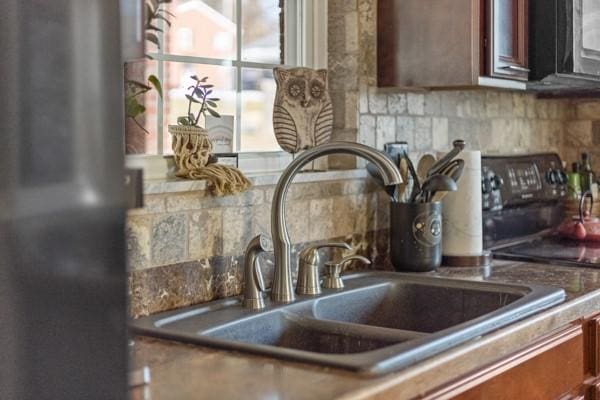 interior details with sink and backsplash