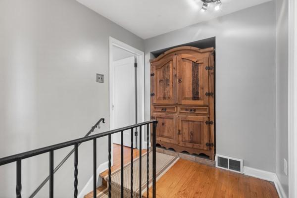 hallway featuring wood-type flooring