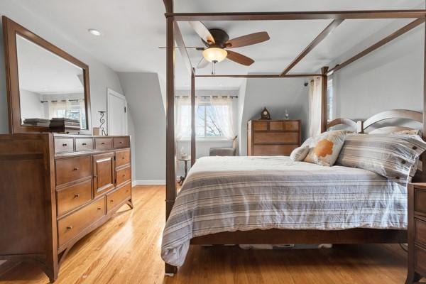 bedroom featuring ceiling fan and light hardwood / wood-style flooring