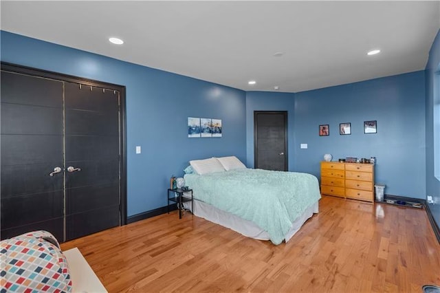 bedroom with light hardwood / wood-style flooring