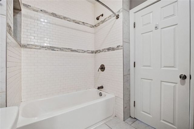 bathroom with tile patterned flooring and tiled shower / bath combo