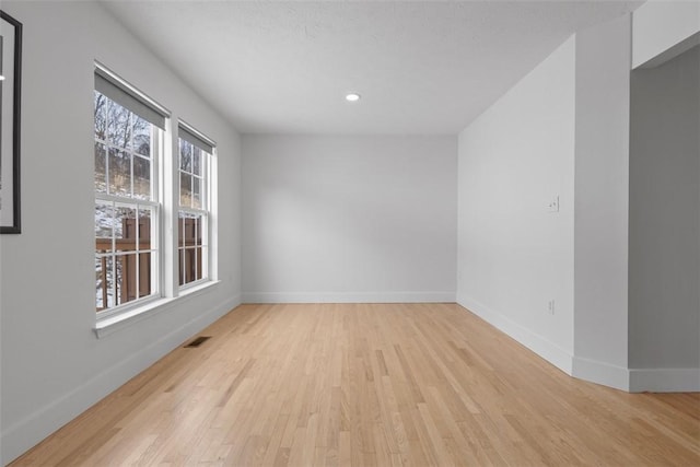 unfurnished room featuring light hardwood / wood-style flooring