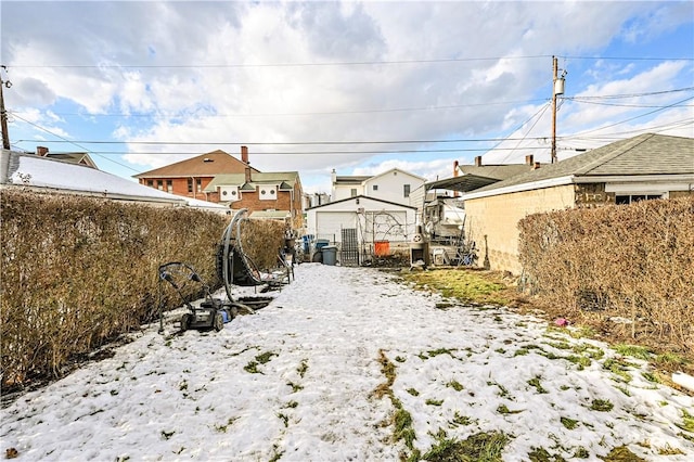 view of yard covered in snow