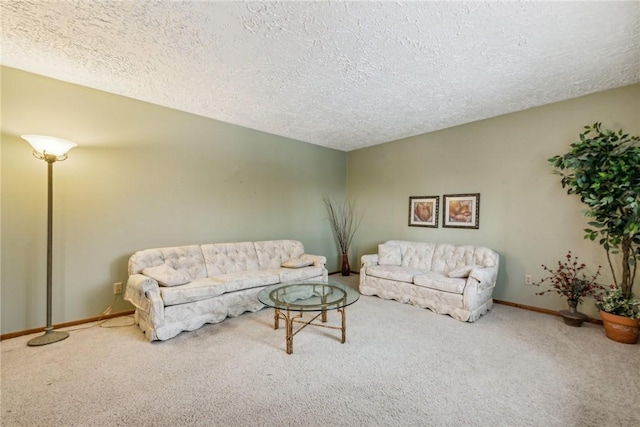 carpeted living room with a textured ceiling