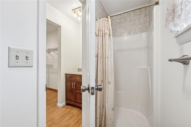 bathroom with wood-type flooring and vanity