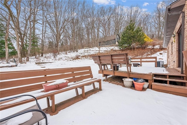 snow covered deck with central AC