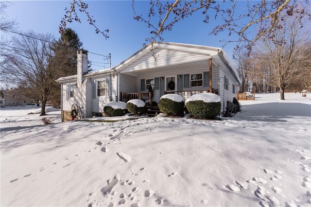 115 Mill Creek Rd, Mill Creek, PA 16145 - view of front of house with a chimney and covered porch
