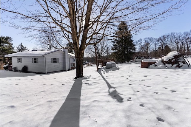 view of yard covered in snow