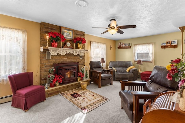 115 Mill Creek Rd, Mill Creek, PA 16145 - carpeted living room featuring plenty of natural light, ceiling fan, a textured ceiling, a stone fireplace, and a baseboard heating unit