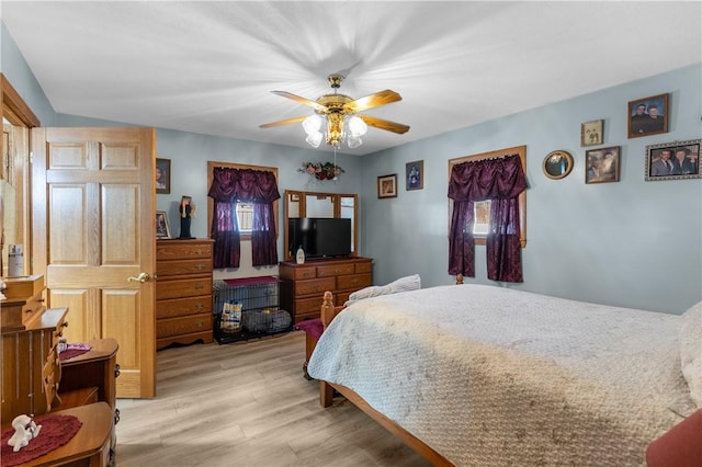 bedroom featuring ceiling fan and light wood-type flooring