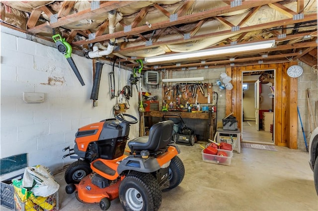115 Mill Creek Rd, Mill Creek, PA 16145 - basement with concrete block wall and a workshop area