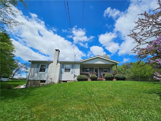 115 Mill Creek Rd, Mill Creek, PA 16145 - view of front of property featuring covered porch, a chimney, and a front lawn