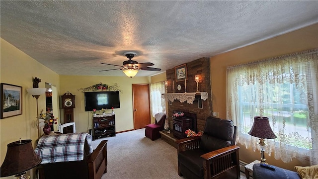 115 Mill Creek Rd, Mill Creek, PA 16145 - carpeted living room with a textured ceiling, a ceiling fan, and a large fireplace