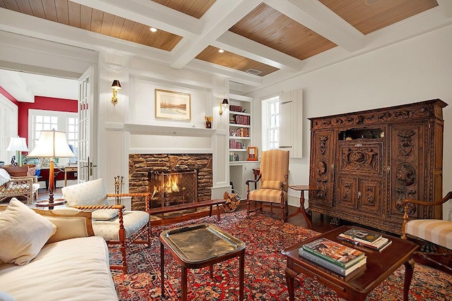 living area with built in features, a fireplace, wooden ceiling, beamed ceiling, and recessed lighting