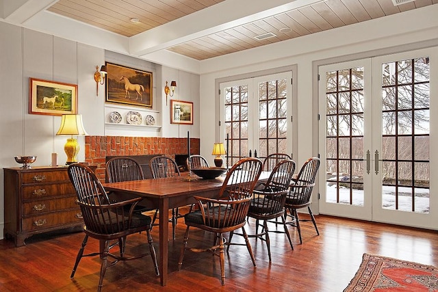 dining space with beamed ceiling, wood-type flooring, wood ceiling, and french doors