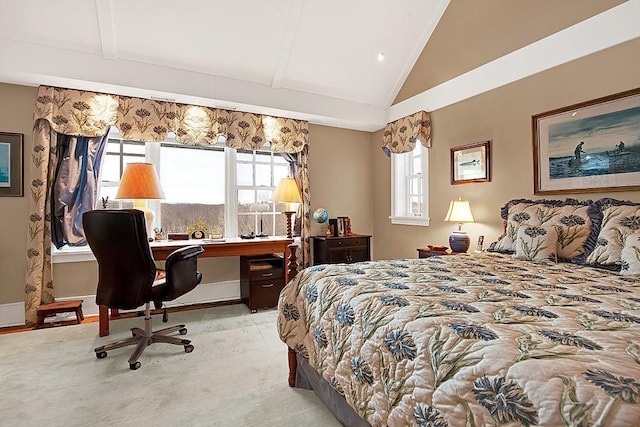 carpeted bedroom with lofted ceiling