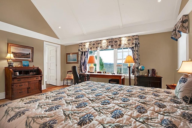 bedroom with high vaulted ceiling