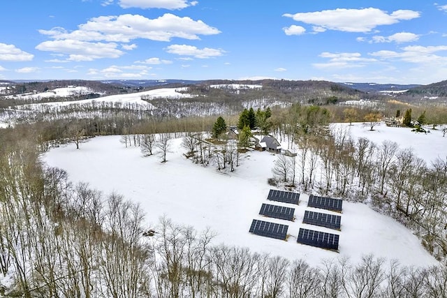 snowy aerial view featuring a mountain view