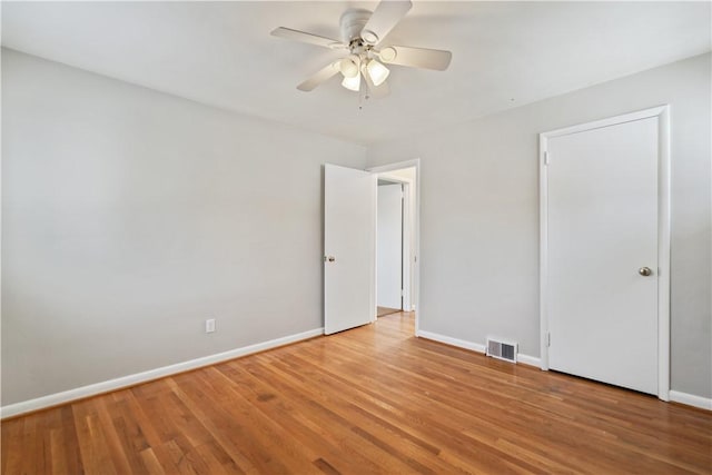 unfurnished bedroom featuring ceiling fan and light hardwood / wood-style floors