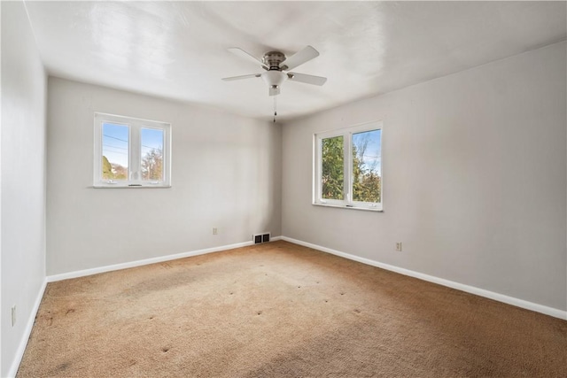 carpeted empty room with ceiling fan