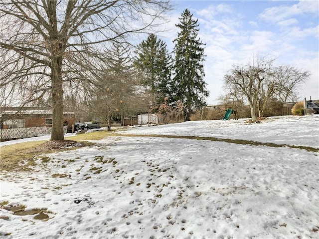 view of yard covered in snow