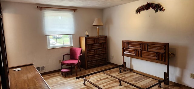 sitting room featuring light hardwood / wood-style floors