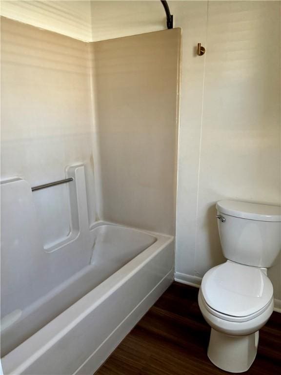 bathroom with hardwood / wood-style flooring and toilet