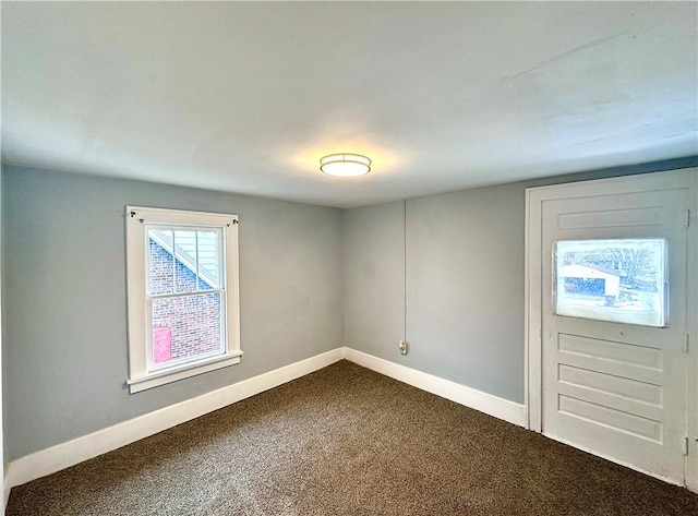 unfurnished room with carpet flooring