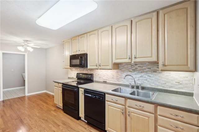 kitchen featuring sink, decorative backsplash, ceiling fan, black appliances, and light wood-type flooring