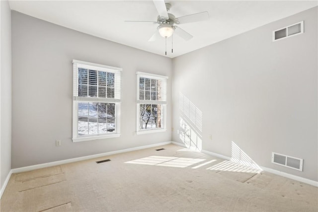 empty room with light carpet and ceiling fan