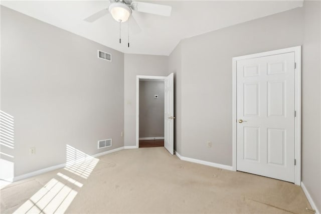 empty room with light carpet and ceiling fan